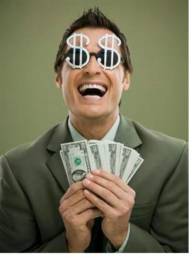 A laughing man wearing sunglasses with dollar signs holding many $20 bills.
