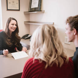 Lindsey Tavlin - Nebraska Diamond Chief Operations Officer and Certified Diamontologist by the Diamond Council of America meets with two clients.